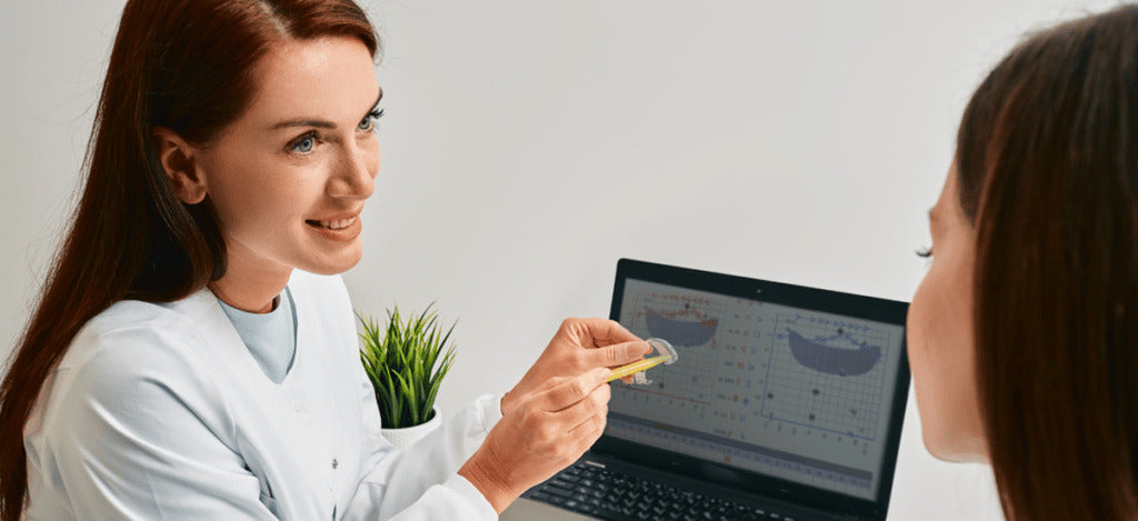 hearing-aid-adjustment-Audiologist-showing-patient-how-to-adjust-hearing-aid