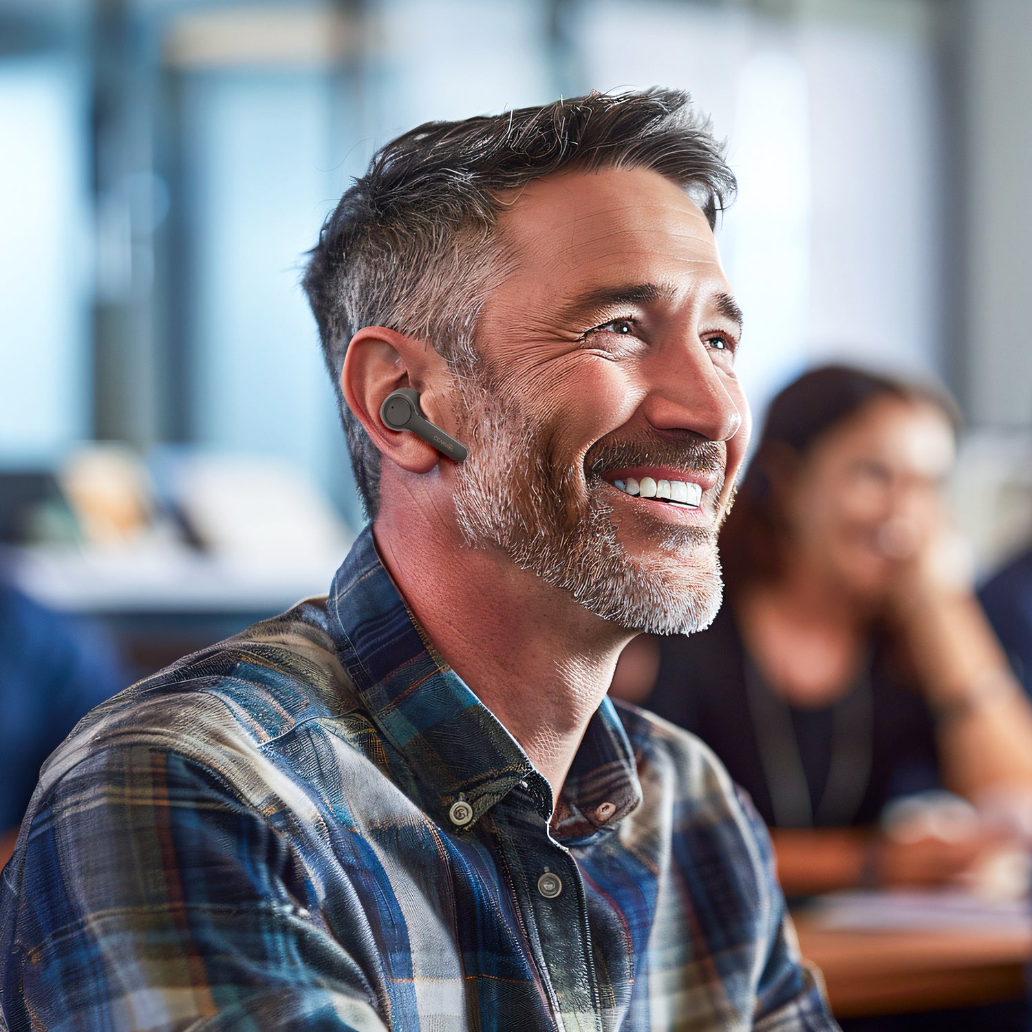 Man smiling confidently with Cearvol OTC hearing aids